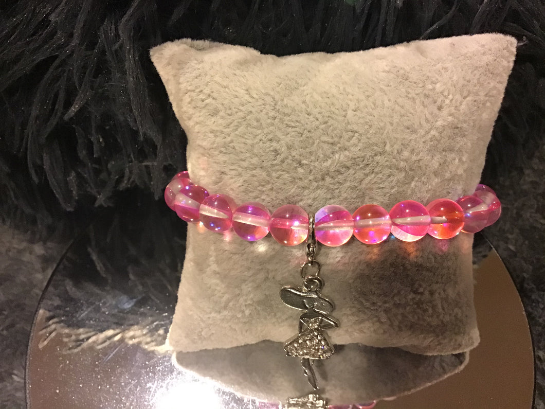 Pink bracelet with silver lady charm